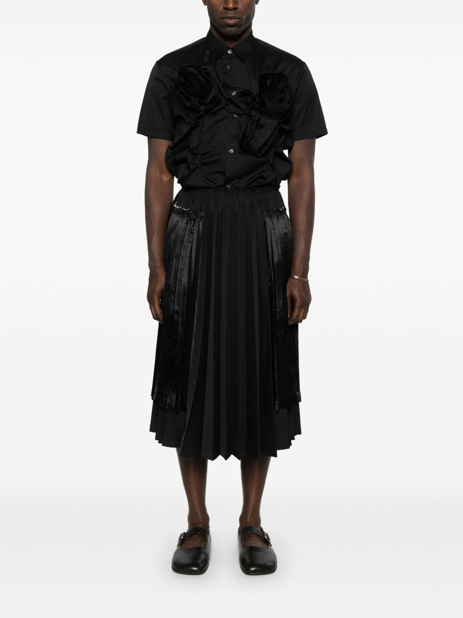 Comme Des Garcons Pleated Midi Skirt for Men Timeless Structured Silhouette with Ribbed Texture in Black