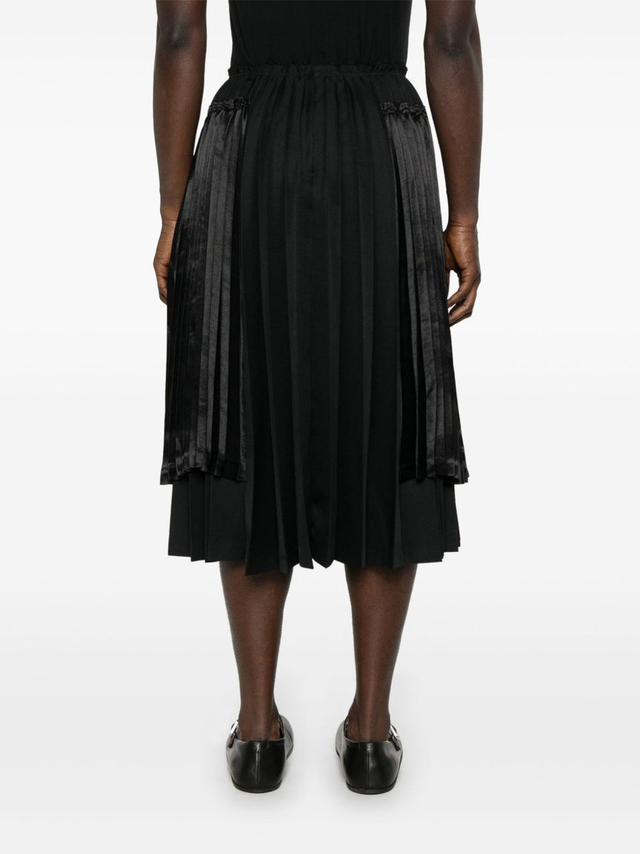 Comme Des Garcons Pleated Midi Skirt for Men Timeless Structured Silhouette with Ribbed Texture in Black