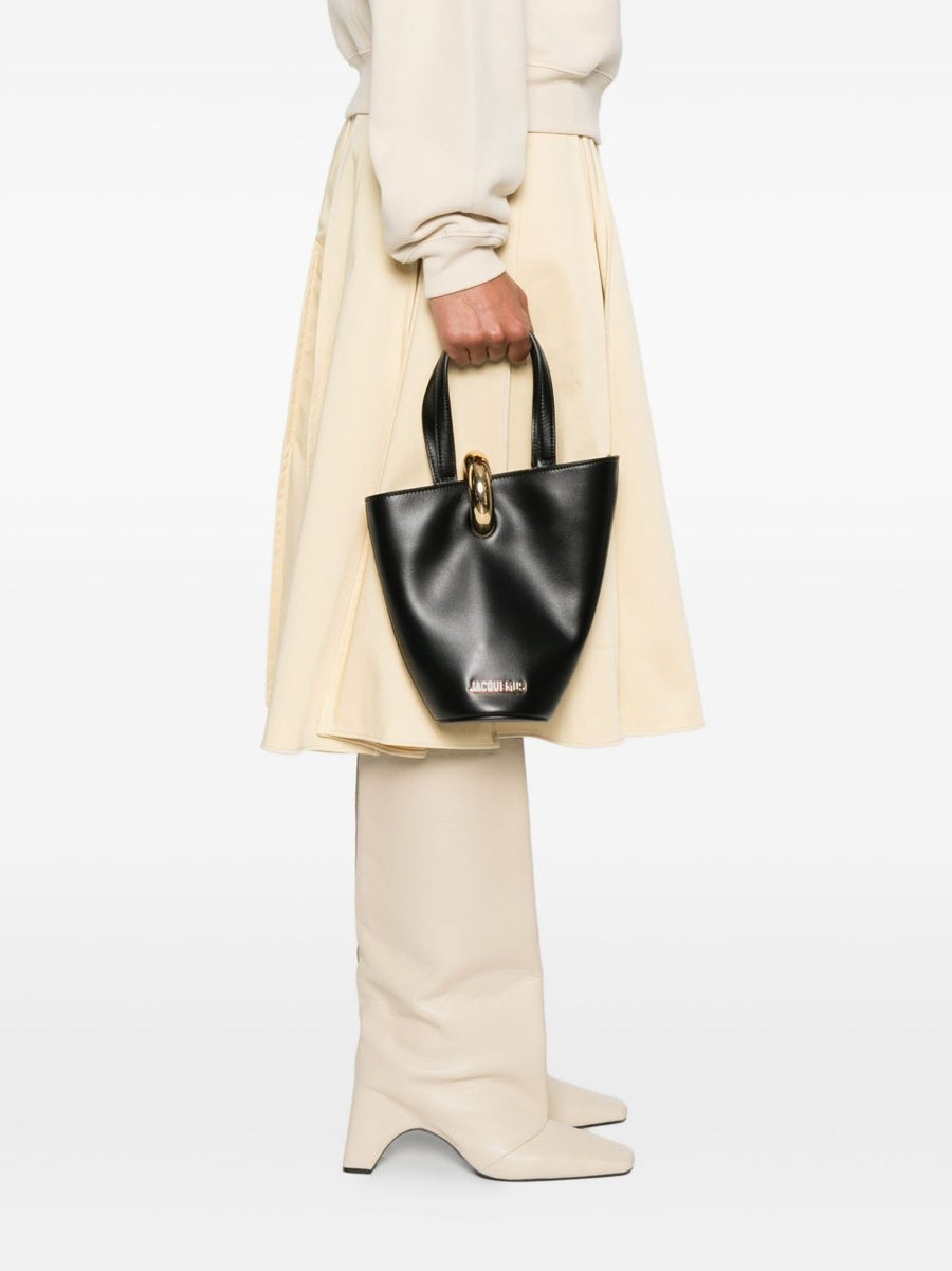 Jacquemus Le Petit Bambola Leather Bucket Bag For Women With Sculptural Asymmetrical Silhouette And Gold Ring Hardware