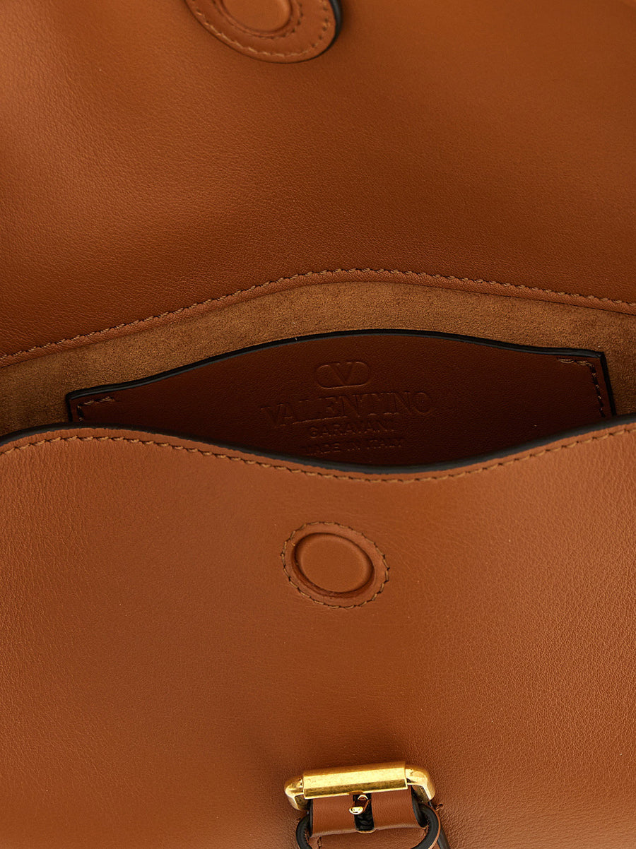 Valentino Garavani Flaneuse Small Shoulder Bag For Women Luxurious Brown Calfskin Adjustable Strap Magnetic Closure